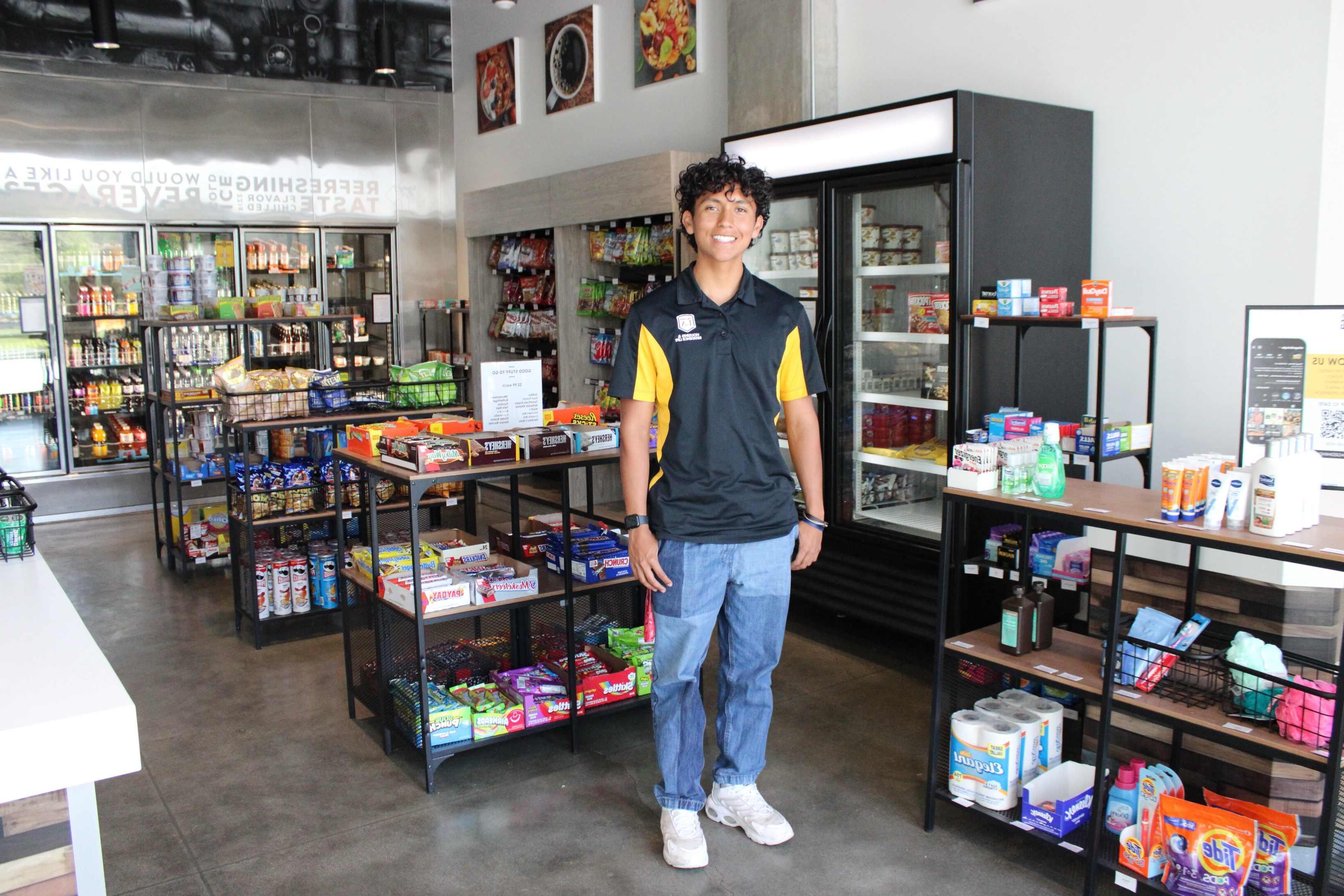 Cal State LA student standing in the Village Marking convenience store in Housing.