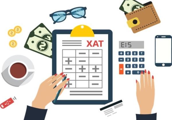 clipart clipboard that reads "tax" with a calculator and dollar bills