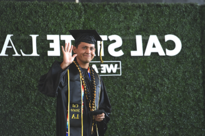 Cal State LA Student at Graduation Waving